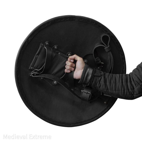 Eastern round shield for armored combat in hands plain central grip