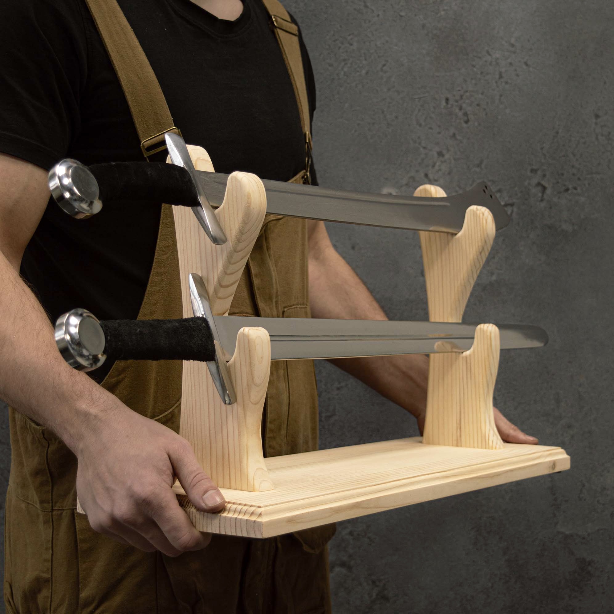 Wooden sword display stand with swords in hands